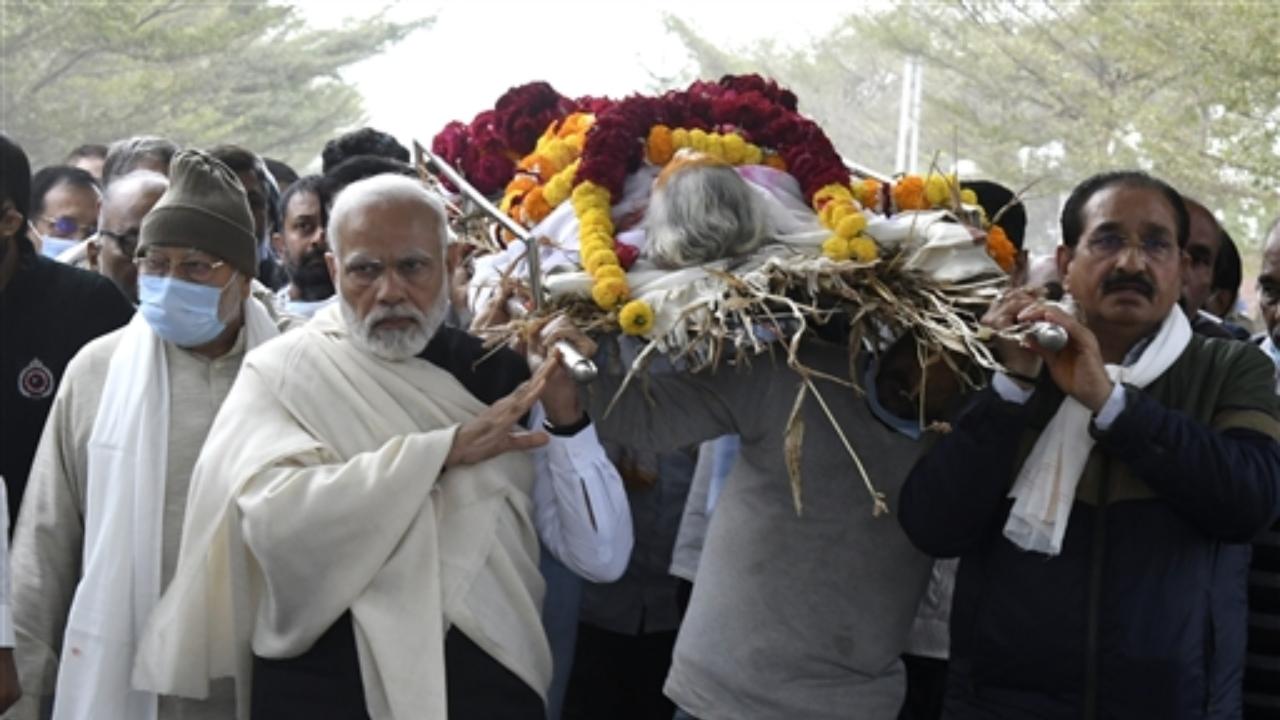 Prime Minister Narendra Modi carries mortal remains of his mother Heeraben Modi, who passed away at the age of 99, in Gandhinagar